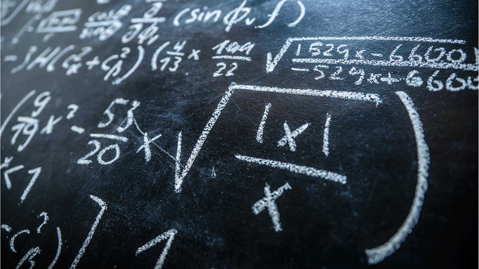 Equation on blackboard representing Applied Mathematics and Statistics program at Clarkson