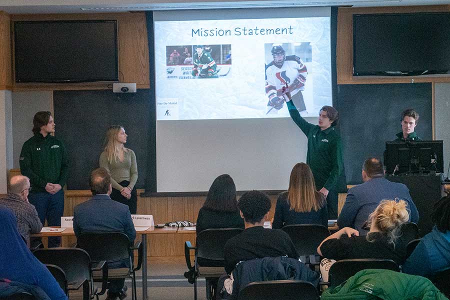 Students doing business pitches