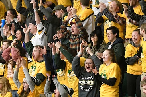 A crowd of fans at a Clarkson hockey game during Cold Out Gold Out