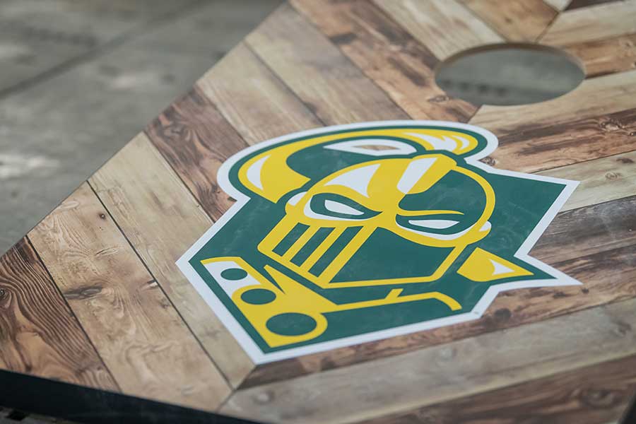 Corn hole board with the Clarkson logo on it