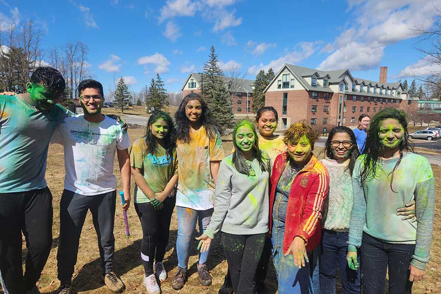 A diverse group of students after a color run