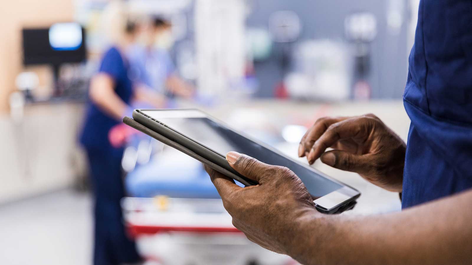 Individual using an iPad in a medical setting