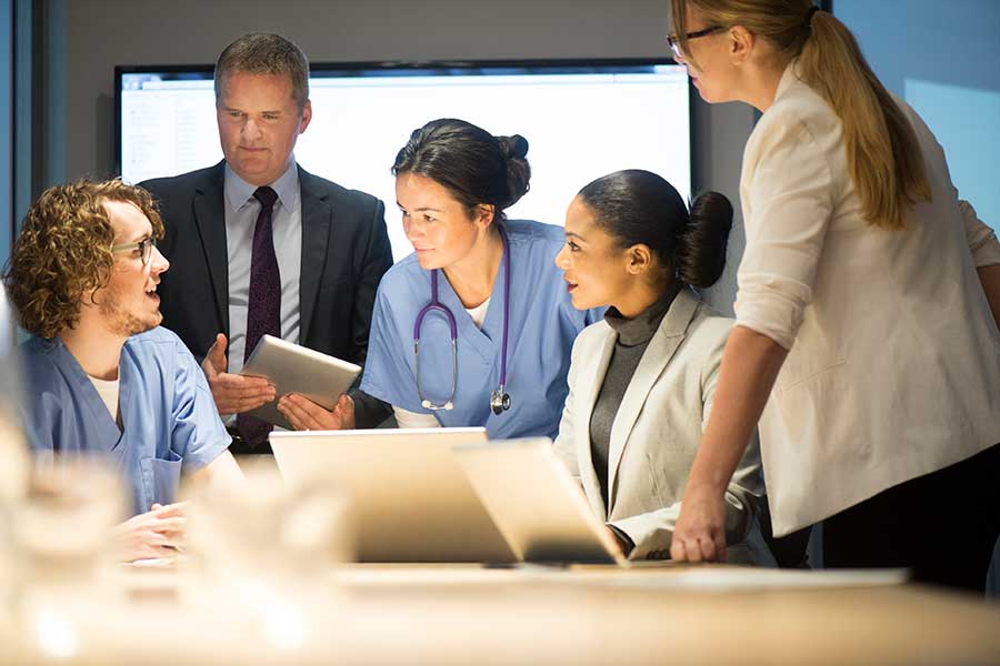 Healthcare individuals in a meeting