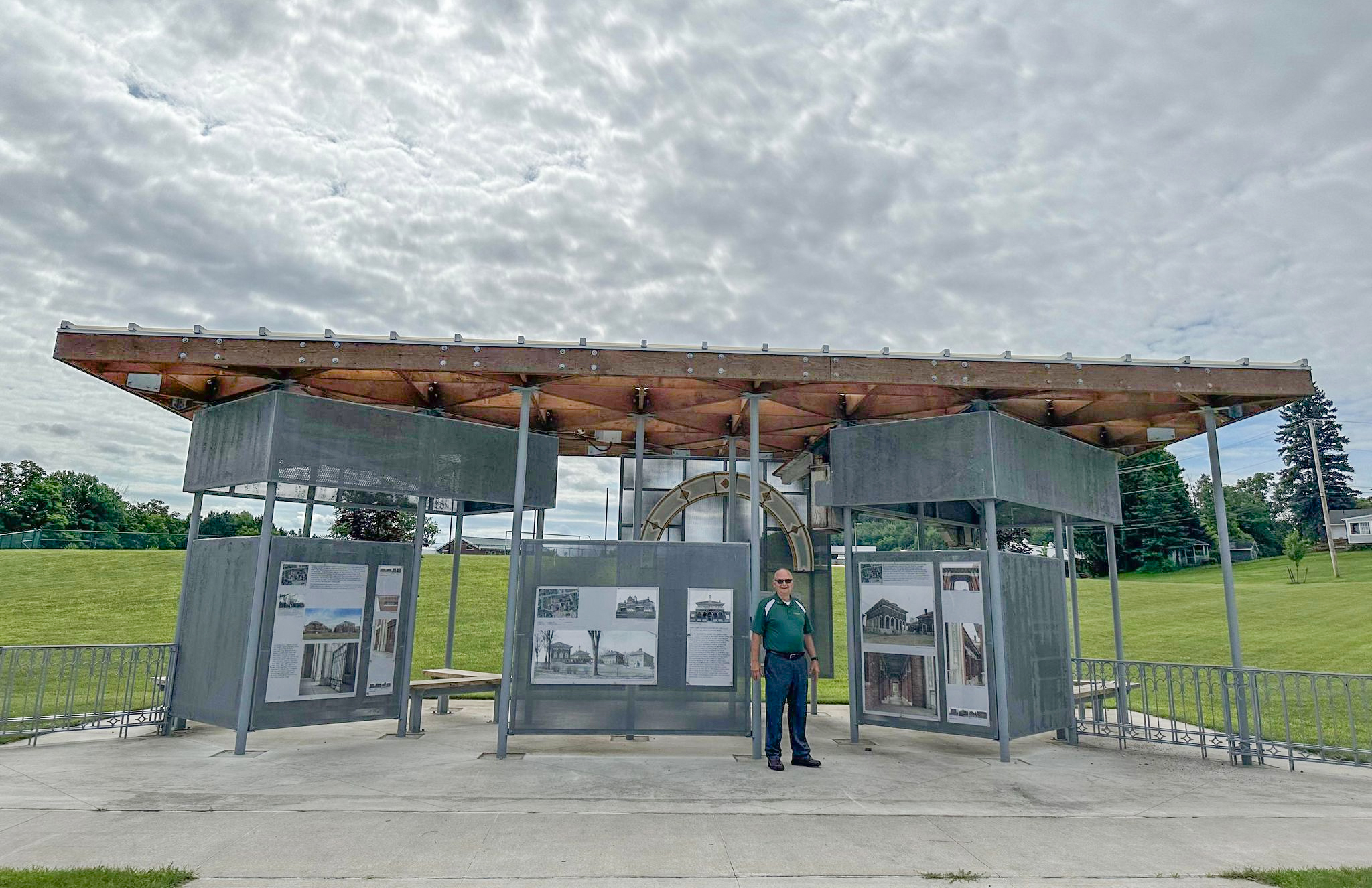 Peter Fadden '71 stands in front of an exhibit for the former Clarkson campus in Malone. 