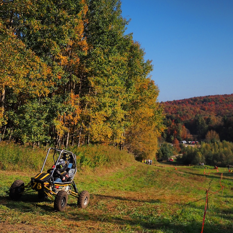 Baja SAE car outside at 7 springs in the fall color trees backdrop