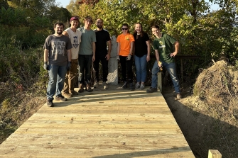 Clarkson University Timber Bridge SPEED Team Builds World’s Smallest Engineered International Bridge at Border Marker in Akwesasne